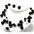 Parure bijoux de perles noir et argent sur fil d’acier - collier et boucles d’oreille